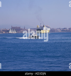 Pilot Launch (Lancha de practicos ) with port pilot on board approaching a passenger ferry about to depart Palma Mallorca. Stock Photo