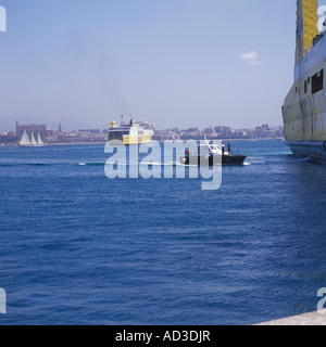 Pilot Launch (Lancha de practicos ) with port pilot on board approaching ISCOMAR passenger / cargo ferry Palma Mallorca Stock Photo