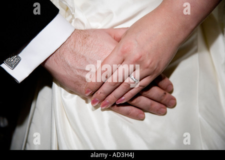 Wedding couple bride and groom holding hands ring and fingers male and female of Newly married Couple Stock Photo
