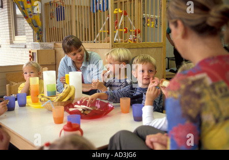 Children eating in a day care center Stock Photo
