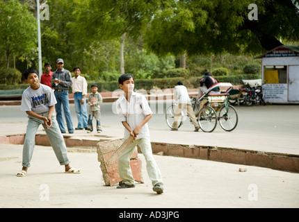 Boys playing cricket in the street, Agra, India. Stock Photo