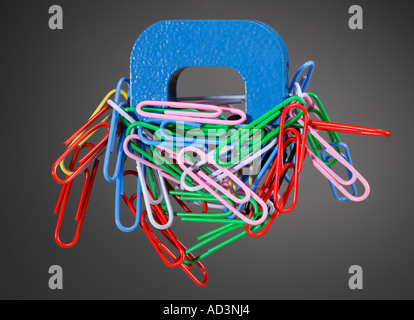 Alnico Horseshoe Magnet and Paper Clips Stock Photo