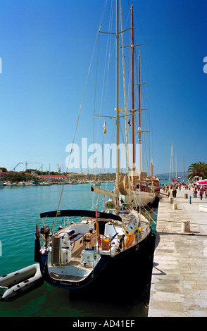 Yachts berthed on the beautiful Riva waterfront of Trogir on the Dalmatian coast of Croatia Stock Photo