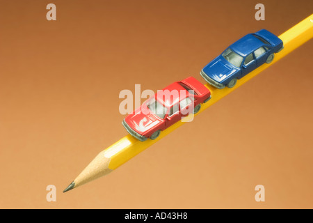 Miniature Cars on Pencil Stock Photo