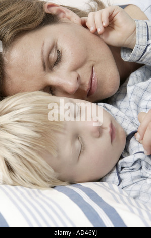 Mother and son sleeping, close-up