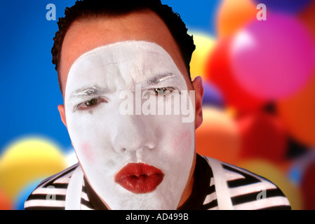 Mime with white painted face with expressive look Stock Photo