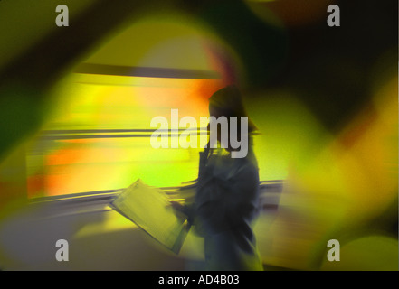 abstract image of businesswoman talking on phone in office Stock Photo