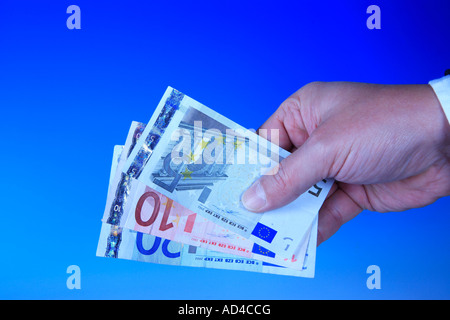 Hand holds euro banknotes Stock Photo