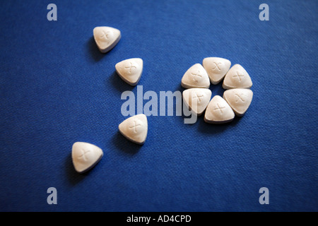 Triangle shaped ecstasy tablets or pills Stock Photo