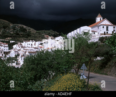 Stormy skies over the white village of Sedella Stock Photo