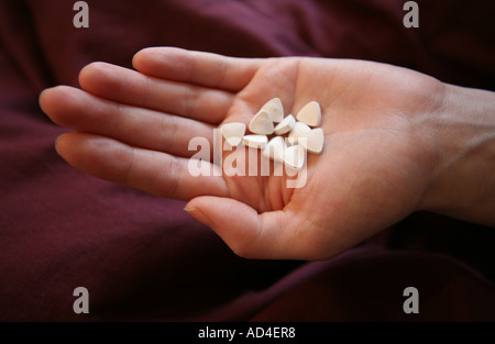 Triangle shaped white ecstasy  tablets Stock Photo