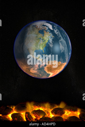 The planet earth being heated by lit coals illustrating global warming climate changes Stock Photo