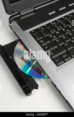 CD stamped 'Made in USA' in the disc drive of a laptop computer Stock Photo