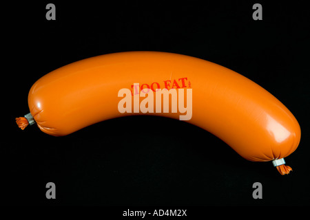 A sausage wrapped in plastic packaging and stamped 'Too Fat' Stock Photo