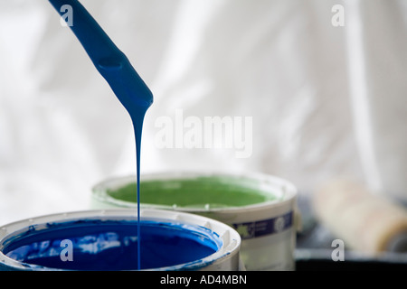 Paint dripping from a paintbrush Stock Photo