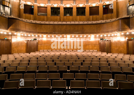 Empty seating in an illuminated art deco theater Stock Photo