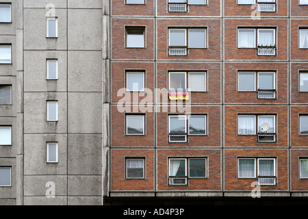 A German flag hanging from the window of an apartment Stock Photo