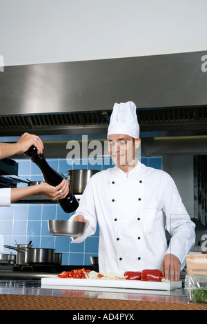 Chefs working in a kitchen Stock Photo
