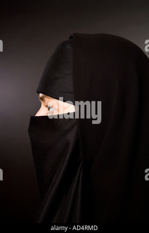 Close up head shot of a Muslim woman in a black hijab burka Stock Photo