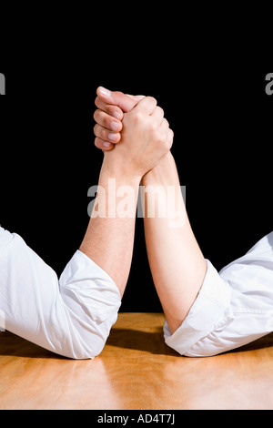 Detail of two men preparing to arm wrestle Stock Photo