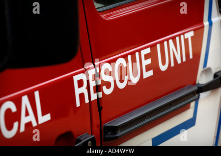 An emergency services vehicle with the word FIRE in reflective lettering on the side of the appliance. Picture by Jim Holden. Stock Photo