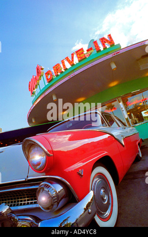 Classic 1955 Ford Fairlane car parked outside trendy American retro Mel's drive-in diner eatery restaurant Stock Photo