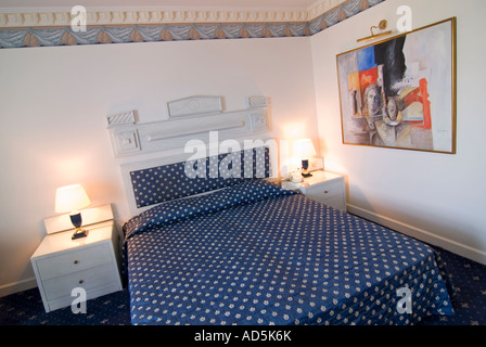 Horizontal wide angle of the interior of a hotel double room freshly made. Stock Photo