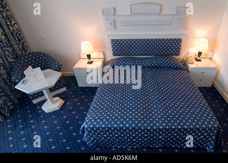 Horizontal interior view of a hotel double room decorated in an 1980's style. Stock Photo