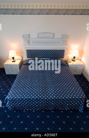 Vertical interior view of a hotel double room ready for occupancy. Stock Photo