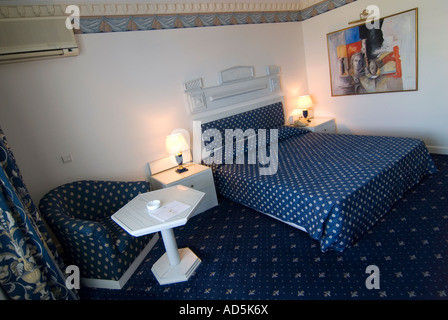 Horizontal interior of a hotel double room ready for occupancy decorated in a 1990's style. Stock Photo