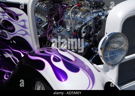 Front fender purple flames paint job on classic Studebaker car hot rod street racer with new chrome engine Stock Photo