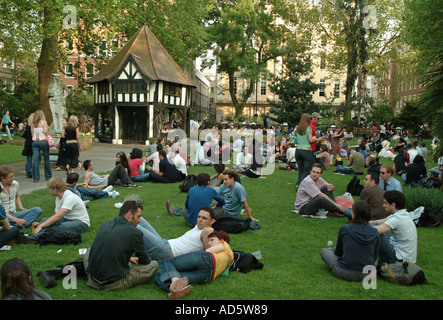 Crowds after work relaxing in Soho square, central London. UK Stock Photo