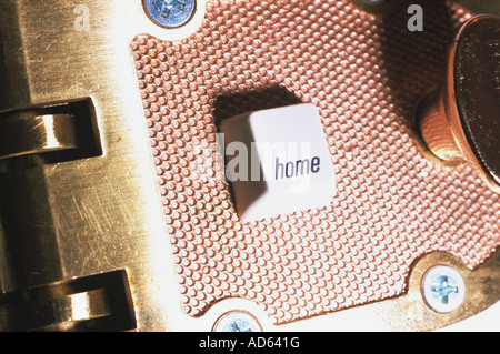 Close-up of a lock with a 'home' computer key Stock Photo