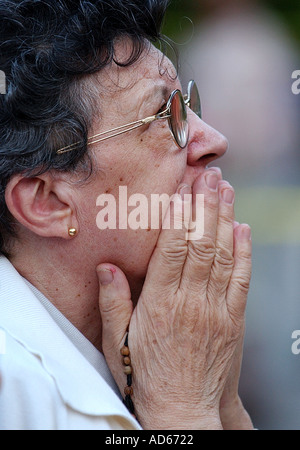 A woman gazes at an apparition of the Virgin Mary that appeared on a window at a Massachusetts hospital Stock Photo