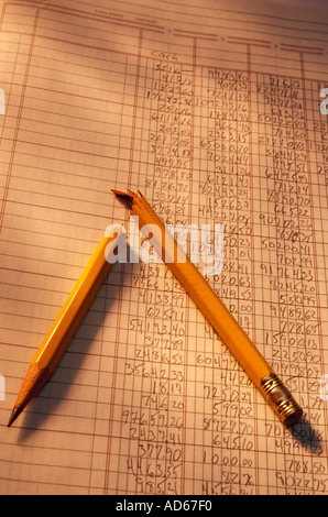 Broken pencil on accounting spread sheet Stock Photo