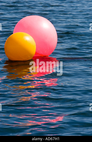 Coloured buoys on the sea Stock Photo
