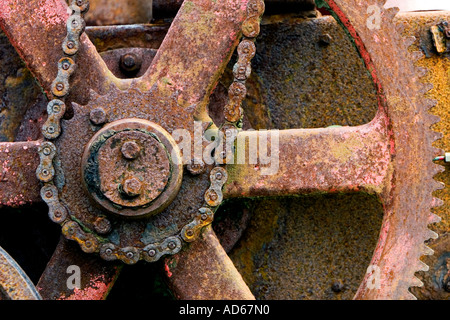Old corroded chain driven farm machinery Stock Photo