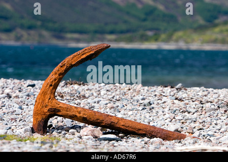 Rusted ships anchor on Glenelg beach with the isle of Skye in the background. Glenelg, Highlands, Western Scotland Stock Photo