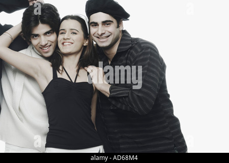 Portrait of two young men with a young woman Stock Photo