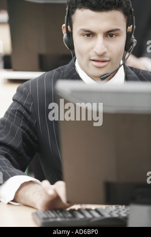 Close-up of a businessman wearing a headset Stock Photo