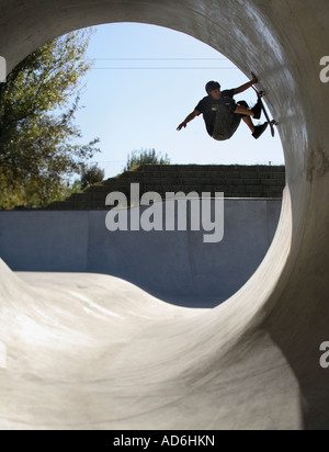 Dave Allen reaches 10.30 Skateboarding in a Full Pipe Stock Photo