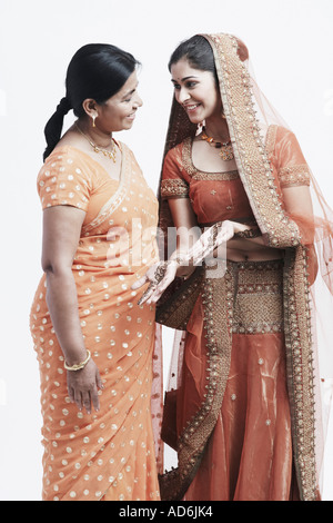 Side profile of a mother and her daughter Stock Photo