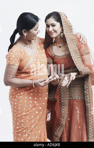 Portrait of a mother standing with her daughter Stock Photo