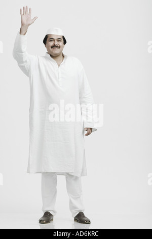 Mature man waving his hand Stock Photo