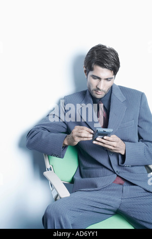 High angle view of a businessman using a personal data assistant Stock Photo