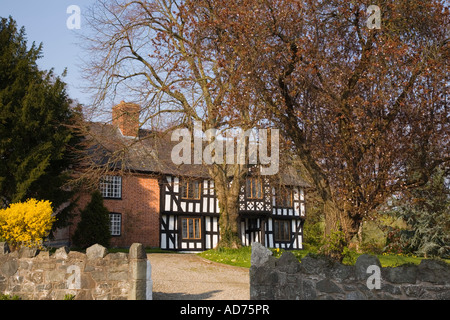 Timber framed black and white 17th century Vicarage 1616 in historic award winning village Berriew Aberriw Powys Mid Wales UK Stock Photo