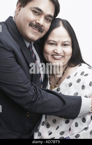 Portrait of a mature man embracing a mature woman Stock Photo