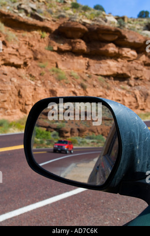 Vehicle in rear view mirror along scenic byway 9 near Springdale and Zion National Park Utah Stock Photo