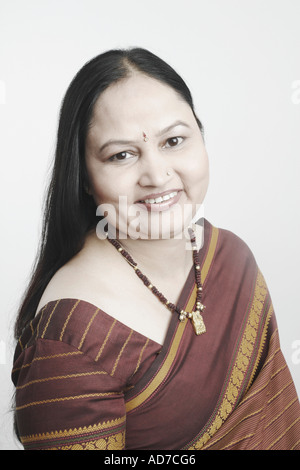 Side profile of a mature woman smiling Stock Photo