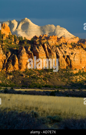 Sunset light through storm clouds on red rock cliffs near Lee Valley Kolob Section Zion National Park Utah Stock Photo